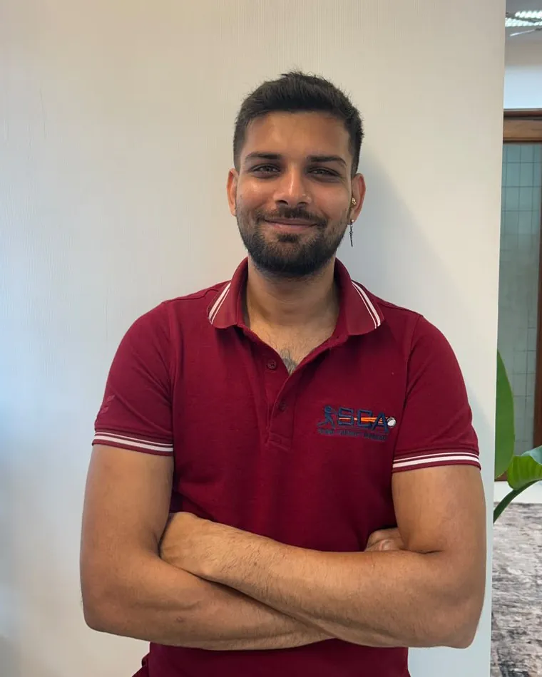 Mr. Jeet Shah, Operations Head and Senior S&C Specialist at Sunil Cricket Academy, in an SCA polo shirt